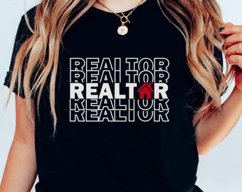 May include: Black t-shirt with the word "REALTOR" repeated four times in white text. The second "REALTOR" has a red house icon in place of the "O".
