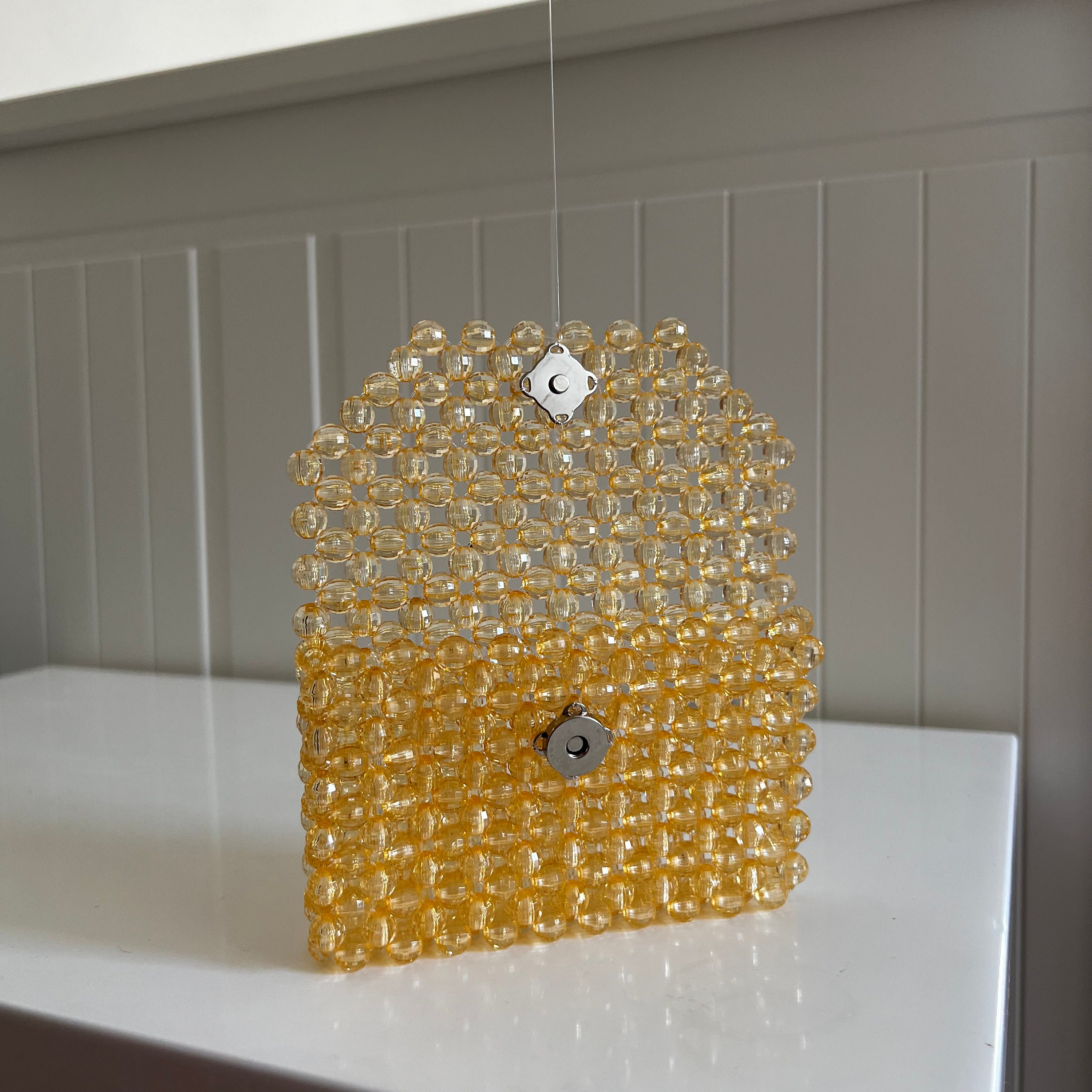 ♡Karat キャラット メタルビーズバック 巾着 ポーチ ゴールド系 ケース付 W by Wpc.「シャイニーシリーズ」よりバッグやポーチなど、全5アイテム