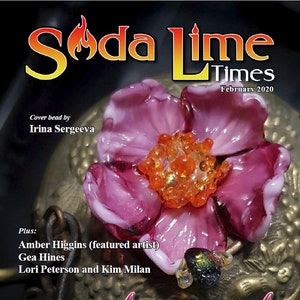 May include: A magazine cover featuring a pink glass flower with a gold background. The magazine is called "Soda Lime Times" and the cover text says "Girly Girl".
