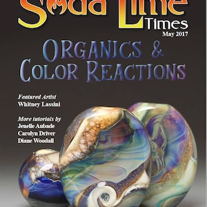 May include: The cover of "Soda Lime Times" magazine, May 2017, features the title "ORGANICS & COLOR REACTIONS." The image showcases three colorful, translucent glass art pieces with swirling patterns and textures. Featured artist: Whitney Lassini.