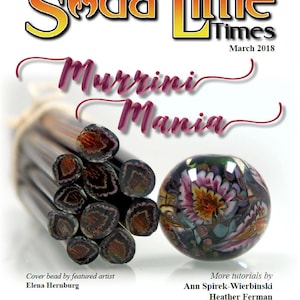 May include: A magazine cover for Soda Lime Times, March 2018, featuring the words "Murrini Mania" in a pink script font. The cover features a close-up of a stack of colorful glass rods and a single round glass bead with a floral pattern.