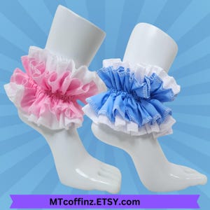May include: Two ruffled ankle cuffs, one pink and white, the other blue and white, displayed on white mannequin feet. The cuffs have a layered design with lace trim. The Etsy shop name MTcoffinz.ETSY.com is at the bottom.