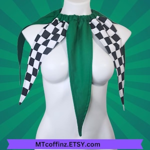 May include: A green and black checkered jester collar with long, pointed ends. The collar is made of fabric and is displayed on a white mannequin. The Etsy shop name MTcoffinZ.ETSY.com is visible at the bottom.