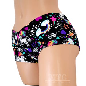 May include: Black underwear with a colourful print of unicorns, rainbows, stars, hearts and clouds.
