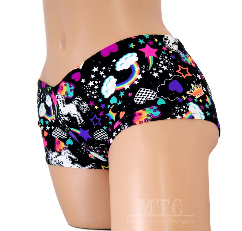 May include: Black underwear with a colourful print of unicorns, rainbows, stars, hearts and clouds.
