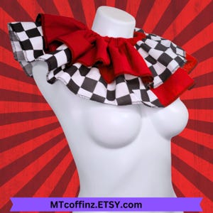 May include: A ruffled collar with a checkerboard pattern and red accents. The collar is displayed on a white mannequin and features the text MTcoffinz.ETSY.com.