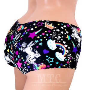 May include: Black underwear with a colourful print of unicorns, rainbows, stars and hearts.