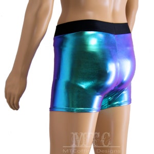 May include: Metallic blue and purple shorts with a black waistband. The shorts are made of a shiny, iridescent fabric.
