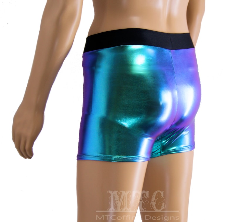 May include: Metallic blue and purple shorts with a black waistband. The shorts are made of a shiny, iridescent fabric.