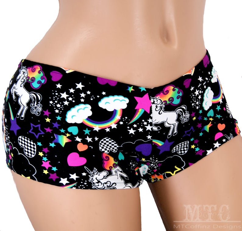 May include: Black underwear with a colourful unicorn, rainbow, and star print.