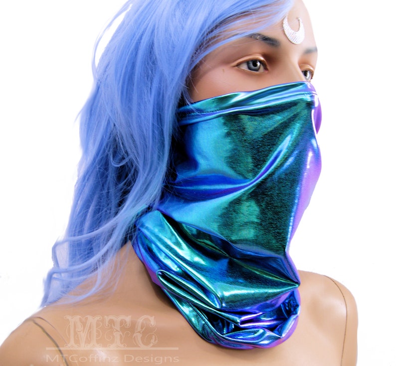 May include: A blue iridescent face mask with a metallic sheen. The mask is made of a stretchy fabric and covers the nose and mouth.