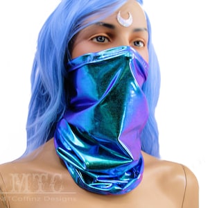 May include: A blue iridescent face mask made of stretchy fabric. The mask is worn by a mannequin with blue hair.