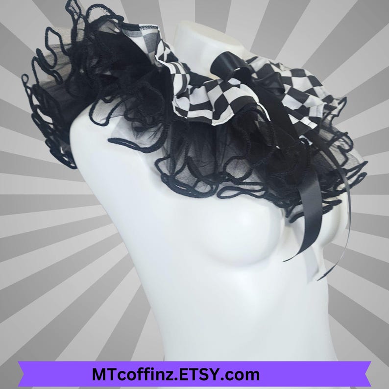 May include: A black and white chequered collar with black tulle ruffles and a black satin bow. The collar is displayed on a white mannequin. The Etsy shop name MTcoffinz.Etsy.com is displayed on a purple banner.