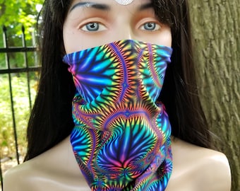 May include: A colorful face mask with a psychedelic pattern in shades of blue, green, pink, and yellow. The mask is made of a soft, stretchy fabric and is designed to be worn over the nose and mouth.