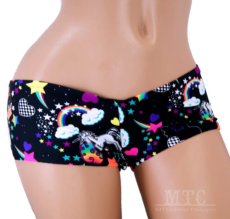 May include: Black and white short shorts with a colourful unicorn, rainbow, and star print.