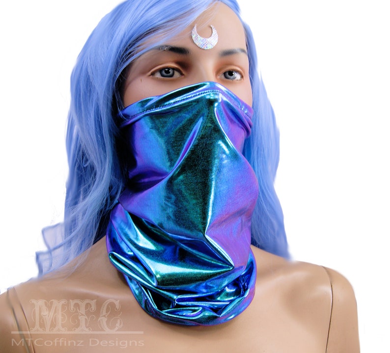 May include: A blue iridescent face mask with a metallic sheen. The mask is made of a stretchy fabric and is designed to cover the nose and mouth.