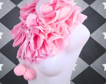 May include: A pink ruffled collar with a white ribbon and two pink pom-poms.  The collar is displayed on a white mannequin against a black and white checkered background.  MTCoffinz.ETSY.COM