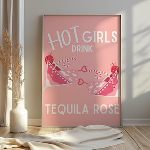 May include: Pink and white poster with the text "HOT GIRLS DRINK TEQUILA ROSE" and a graphic of two pink cocktails with cherries and candy canes.