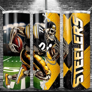 May include: A stainless steel tumbler featuring a football-themed design. The design includes a skeleton wearing a football uniform, holding a football, and the word "STEELERS" in bold letters. The color scheme is black and yellow.