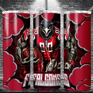 May include: A red and black stainless steel tumbler with a graphic of a cartoon football player wearing a red jersey with the word "FALCONS" on it. The player is holding a football and has a fierce expression on his face.