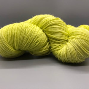 May include: A skein of bright yellow yarn, perfect for knitting or crocheting.