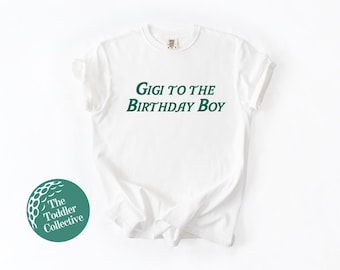 May include: White t-shirt with green text that reads "Gigi to the Birthday Boy".