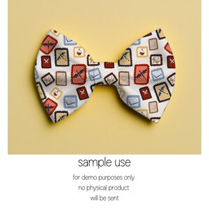 May include: A white bow tie with a repeating pattern of postage stamp-like designs featuring dragons, books, and potion bottles in red, blue, and gold. The bow tie is set against a yellow background. The text "sample use" is visible.