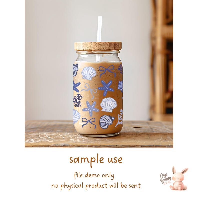 May include: A clear glass mason jar with a wooden lid and a straw. The jar is filled with a light brown liquid and decorated with a blue and white seashell pattern. The text "sample use" is written below the jar. The text "file demo only" is written below "sample use". The text "no physical product will be sent" is written below "file demo only".