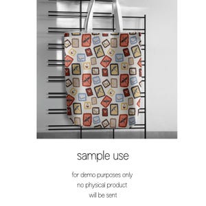 May include: A white tote bag with a repeating pattern of postage stamp designs in red, yellow, blue, and brown. The bag has white handles and the text "sample use" and other text below it.