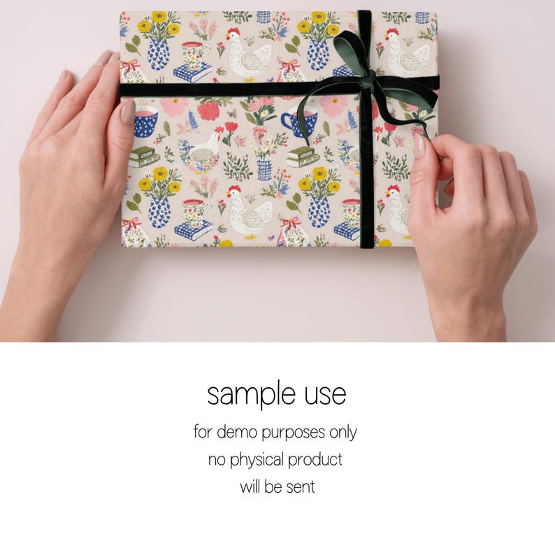 May include: A gift box wrapped in patterned paper with illustrations of chickens, vases of flowers, books, and teacups. The box is tied with a black velvet ribbon and a dark green bow. The text "sample use" is visible.
