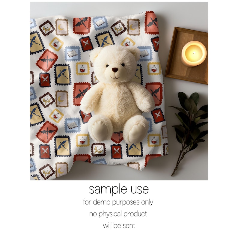 May include: A cream-colored teddy bear sits on a white fabric patterned with colorful postage stamp designs. The stamps feature dragons, books, and potion bottles. A lit candle in a wooden tray and greenery are also present. Text on the image reads: "sample use for demo purposes only no physical product will be sent."