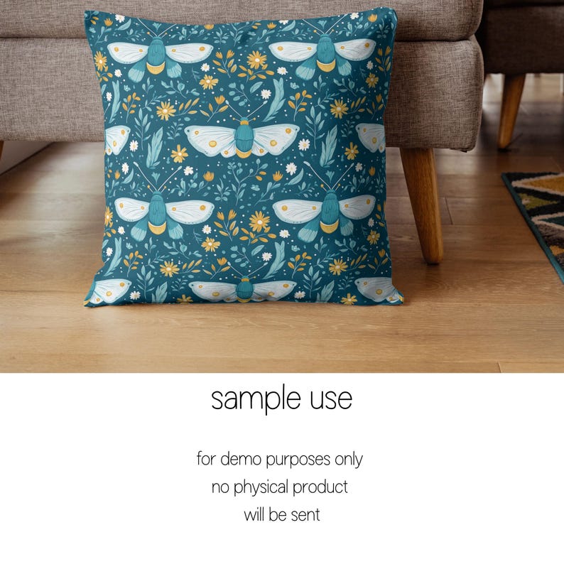 May include: A teal blue throw pillow with a repeating pattern of white butterflies and yellow flowers. The pillow is on a brown couch.