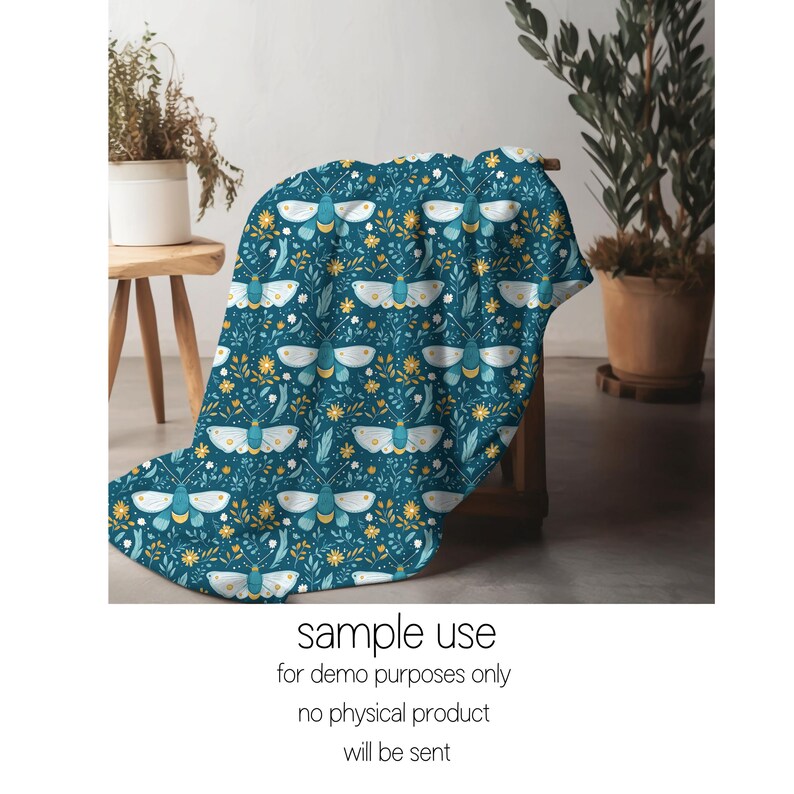 May include: A teal blue throw blanket with a repeating pattern of white butterflies and yellow flowers.