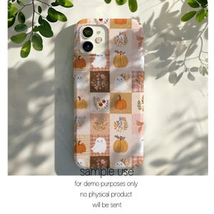 May include: A smartphone case featuring a grid pattern of alternating squares. The design includes illustrations of orange pumpkins, white ghosts with simple facial features, and various botanical sprigs in shades of brown and muted orange.