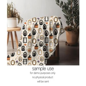 May include: A cream-colored Halloween-themed blanket featuring framed illustrations of ghosts, black cats, pumpkins, and floral accents. The blanket is draped over a wooden chair. The text "sample use for demo purposes only no physical product will be sent" is visible.