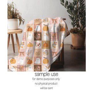 May include: A soft throw blanket featuring a repeating grid pattern of autumn-themed illustrations including orange pumpkins, white ghosts, floral bouquets, and tan bows in shades of cream, brown, and orange on a light-colored background.
