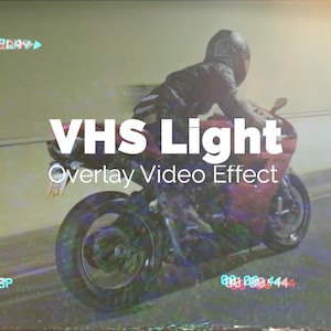 May include: A red motorcycle with a rider, captured in motion. The image has a retro VHS effect with the text "VHS Light Overlay Video Effect". The scene is set on a road with a blurred background, evoking a sense of speed and nostalgia.