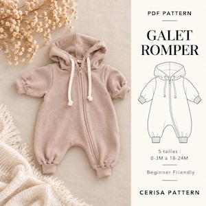 Op de afbeelding: Een oudroze romper met capuchon, ritssluiting aan de voorzijde en witte trekkoorden. De afbeelding bevat een technische lijntekening van het kledingstuk met het label PDF PATTERN GALET ROMPER, 5 tailles: 0-3M tot 18-24M, Beginner Friendly, CERISA PATTERN.