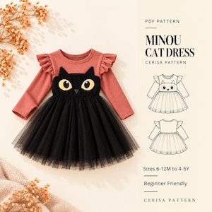 May include: A long-sleeve dress with a dusty rose bodice, ruffled shoulders, and a black tulle skirt. A black cat face applique with yellow eyes is centered on the bodice. Text reads: PDF PATTERN MINOU CAT DRESS CERISA PATTERN Sizes 6-12M to 4-5Y.