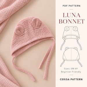 Pode incluir: Um gorro de musselina rosa empoeirado com duas pequenas orelhas arredondadas no topo e longas fitas para atar. A imagem inclui o texto PDF PATTERN LUNA BONNET, desenhos de linha do gorro e o texto Sizes: 0M-4Y Beginner Friendly CERISA PATTERN.