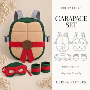 May include: A PDF pattern for a Carapace Set featuring a green and tan turtle shell backpack with gray herringbone straps, a red felt eye mask, and two green wrist cuffs. The text reads PDF PATTERN CARAPACE SET, Sizes: 2-4Y, 5-7Y, CERISA PATTERN.