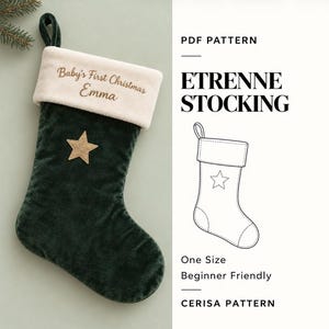 May include: A dark green velvet Christmas stocking with a cream-colored cuff embroidered with the text Baby's First Christmas Emma and a gold star appliqué. Includes a PDF pattern for the Etrenne Stocking by Cerisa Pattern.