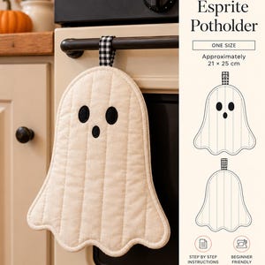 May include: A ghost-shaped potholder made of off-white quilted fabric with black embroidered eyes and mouth, featuring a black and white gingham hanging loop. The PDF sewing pattern text includes the title Esprite Potholder and dimensions of 21 x 25 cm.
