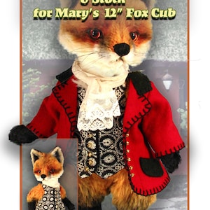 May include: A red riding jacket, vest, and stock for a 12-inch fox cub doll. The doll is wearing the outfit and has a black and white patterned vest. The doll is standing on a brown surface with a green plant in the background. The text "May Secret Garden" is at the bottom of the image.