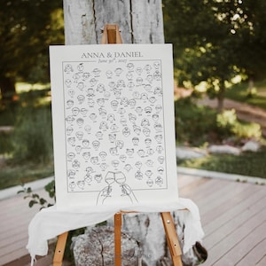 May include: A white canvas sign on a wooden easel, featuring a black and white illustration of numerous faces and two hands toasting wine glasses. The text "ANNA & DANIEL. June 30th, 2027" is printed at the top.