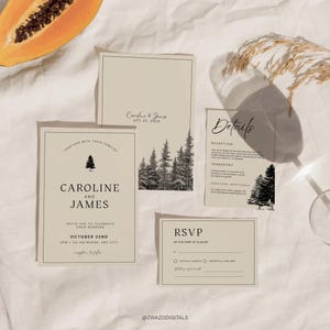 May include: A set of wedding invitations with a minimalist design. The invitations are beige with black text and illustrations of pine trees. The text includes the names "Caroline and James", the wedding date, and RSVP information.
