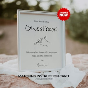 Pode incluir: Uma placa emoldurada branca com a palavra "Guestbook" em uma fonte manuscrita. A placa inclui instru&ccedil;&otilde;es para desenhar e assinar, com um adesivo vermelho "AVAILABLE NOW" no canto. A parte inferior da placa diz "MATCHING INSTRUCTION CARD" e "LINK IN DESCRIPTION".