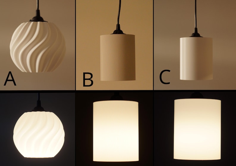 Pu&ograve; includere: Un set di tre lampade a sospensione con diversi paralumi. La prima ha un design bianco a spirale, la seconda ha delle scanalature verticali e la terza &egrave; un cilindro liscio. Tutte hanno cavi e raccordi neri.