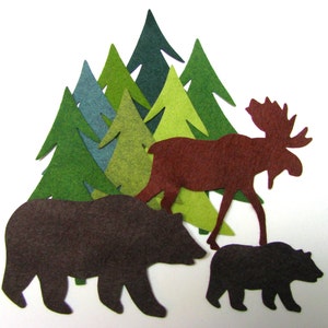 May include: Felt cut-outs of a brown bear, a brown moose, and a brown bear cub. The animals are surrounded by green, blue and yellow felt trees.