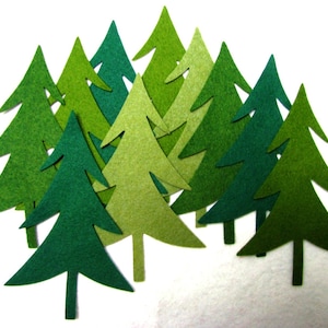May include: A collection of felt Christmas trees in various shades of green. The trees are arranged in a cluster, with some overlapping.